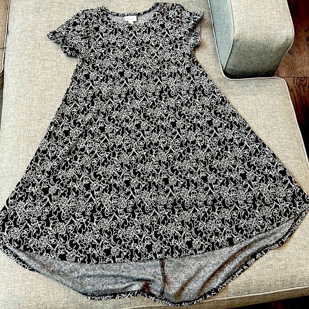 Black dress with white flower detailing.